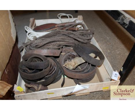 A collection of old belts, vintage table tennis bats, rope etc. 