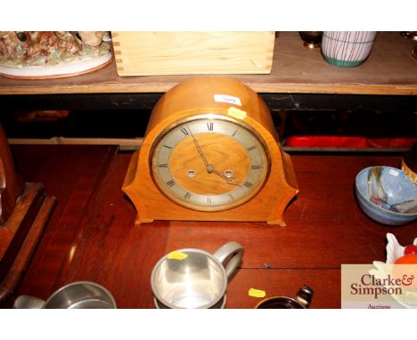 A walnut cased mantel clock 