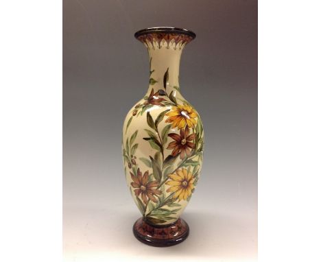 A Doulton Lambeth Faience slender ovoid vase, decorated by Matilda S Adams, painted with flowers and foliage in shades of yel