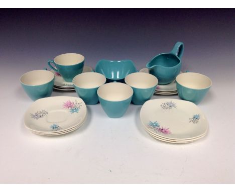 A Midwinter Stylecraft Fashion Shape Quite Contrary pattern tea set printed with stylised starbursts in pink, grey and blue, 