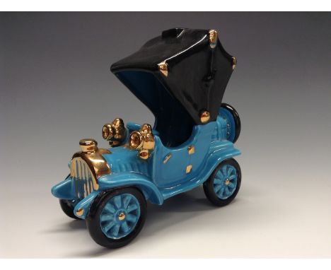 A Bretby novelty model of an early 20th century motor car, light blue glaze, black matt canopy, the details picked out in gil