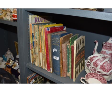 An assortment of vintage books including cookery and Rupert Bear