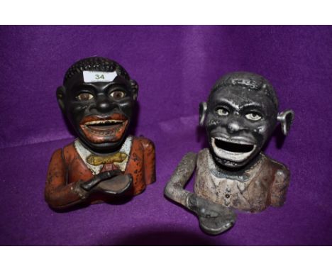 Two mechanical cast money boxes one being genuine vintage and similar modern cast version