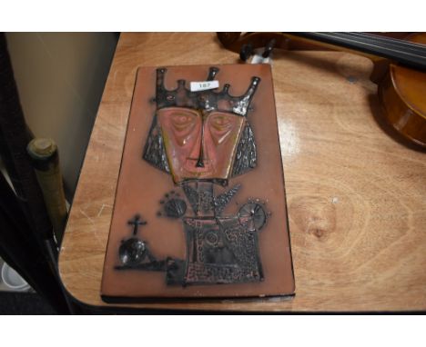 A ceramic mid century wall tile with Nordic Viking style imagery