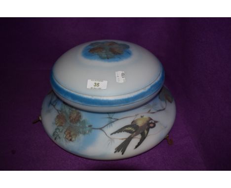 A vintage fly catcher light shade painted with birds and foliage