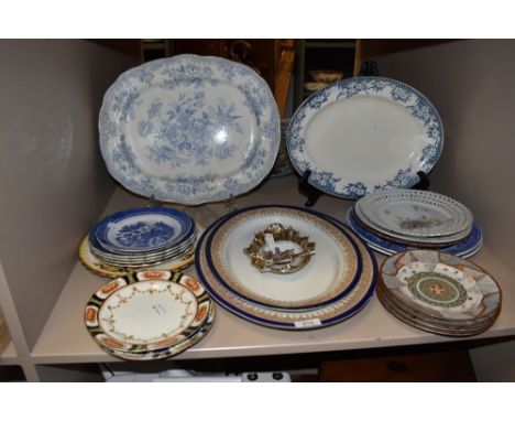A mixed collection of vintage and antique plates and platters in various styles including Royal Worcester.