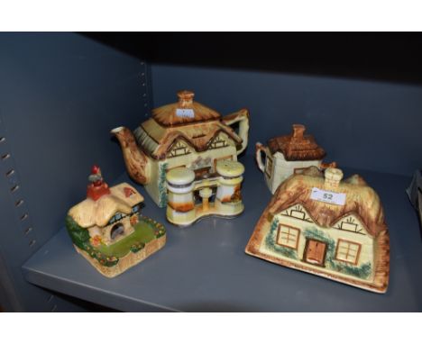 A collection of hand painted country cottage ceramics including tea pot, cheese dome, lidded sugar basin and similar items.