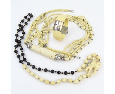 Three Piece Lot Including Carved and Black Onyx Bead Necklace, Carved Bone Necklace and Bangle Bracelet. Unsigned. Good vinta