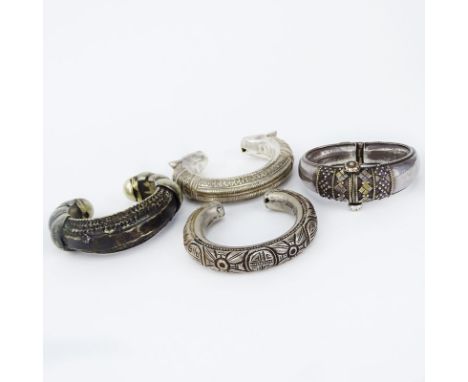 Collection of Four (4) Vintage Middle Eastern / Indian or African Silver Cuff Bangle Bracelets. Unsigned. Cracks to interior 