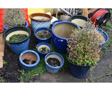 TWELVE BLUE GLAZED GARDEN PLANT POTS of differing sizes and styles the largest diameter being 41cm (12)