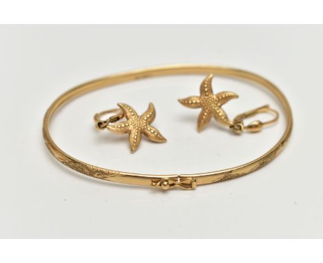 A 9CT GOLD BANGLE AND A PAIR OF EARRINGS, the thin bangle decorated with a floral pattern, integrated clasp with figure of ei