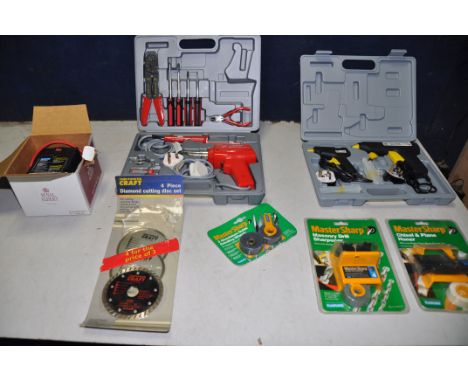 A HILKA ELECTRIC SOLDERING KIT along with a Powermaster hot melt glue gun kit, Plasplug master sharp workstation (all in new 