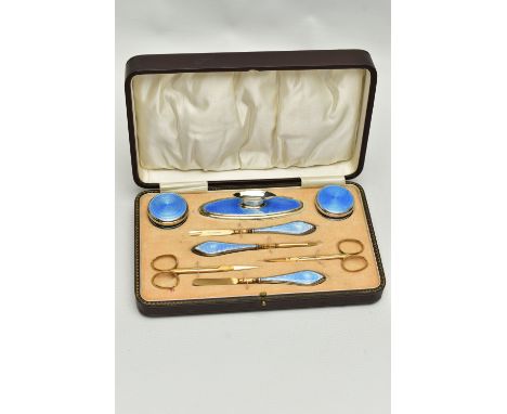 AN EARLY 20TH CENTURY CASED SILVER GUILLOCHE ENAMEL MANICURE SET, eight piece set comprising of cuticle pushers, nail file, c
