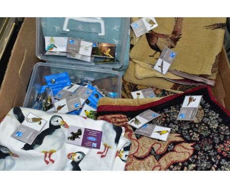 A BOX CONTAINING A TUB OF APPROXIMATELY NINTEY RSPB ENAMEL BADGES, together with an RSPB cushion cover, unbranded Puffin cush