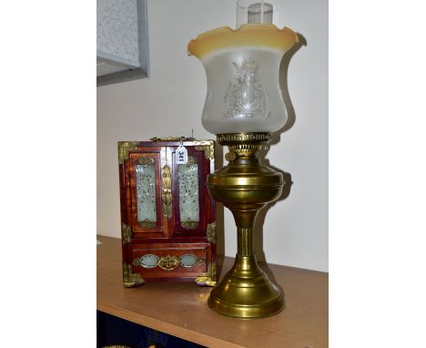 A CHINESE JEWELLERY BOX AND A BRASS BODIED OIL LAMP, the wooden jewellery box having brass handles and fittings, carved stone