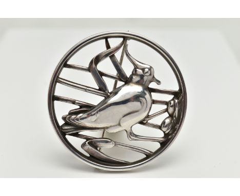 A GEORG JENSEN SILVER BROOCH, of an openwork circular form displaying a bird in a nest within reeds, signed to the reverse 'G