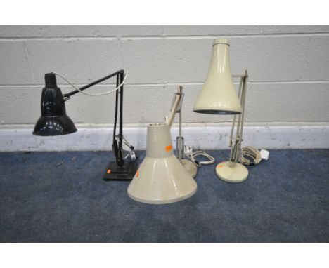 A BLACK FINISH HERBERT TERRY ANGLE POISE DESK LAMP, a cream angle poise desk lamp, and another desk lamp (condition:-all unte