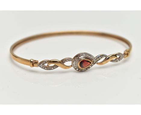 A 9CT GOLD GARNET AND DIAMOND SET BANGLE, thin band, locking hinged clasp set with a pear cut garnet within a single cut diam