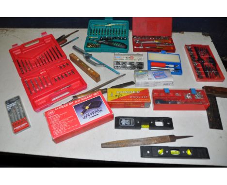 A SELECTION OF CASED TOOLS to include three driver/socket sets, cased scalpel set, cased tap and die set, cased drill bit set