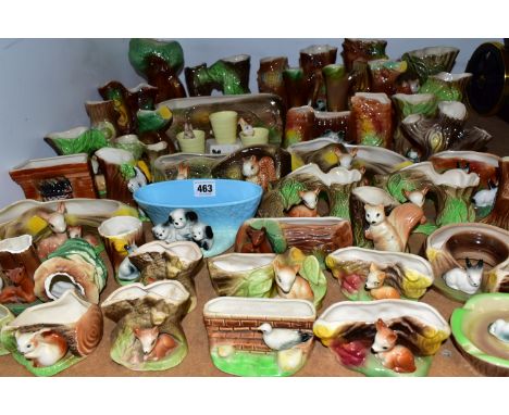 A COLLECTION OF OVER FORTY PIECES OF WITHERNSEA EASTGATE POTTERY, the majority posy vases / vases with tree trunk and animal 