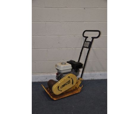 A WAKER PLATE COMPACTOR model unknown has a Honda engine (UNTESTED but engine pulling freely)