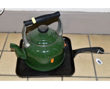 A CAST IRON GRIDDLE PAN AND LE CREUSET KETTLE, a dark green 2.1 litre Le Creuset kettle suitable for use on all heat sources 