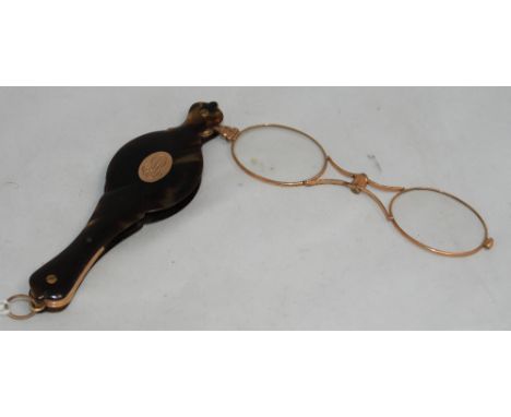 		A Victorian tortoiseshell and gold plated lorgnette. 4 1/2' high