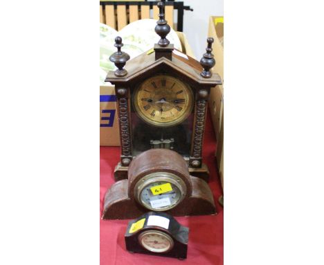 		A continental pine cased mantle clock, a motor clock mounted in a case and a miniature mantle clock