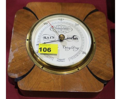 		A 1930's Short and Mason walnut and ebonised aneroid wall barometer. 8 1/2' high