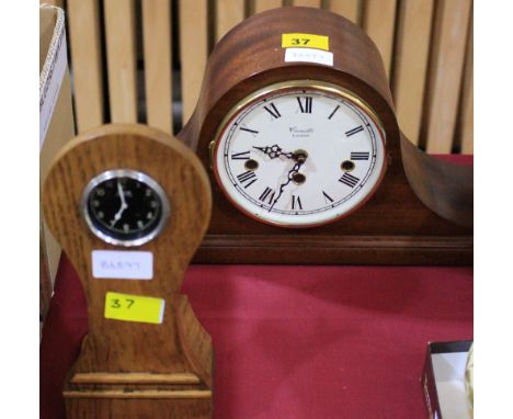 		An oak mounted Jaeger motor clock and a modern mantle clock