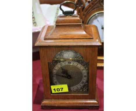 		A small walnut bracket clock with platform lever escapement. 9' high