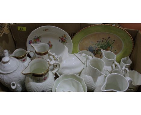 		A box of ceramic jugs etc.