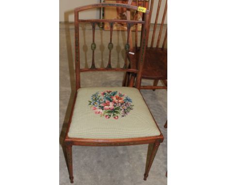 		An Edwardian satinwood side chair, finely painted with garlands of flowers and portrait medallions to the slender splats. (