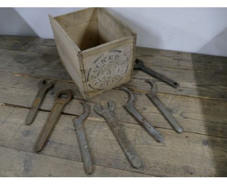 Wooden crate containing vintage Rolls Royce spanners and tools.