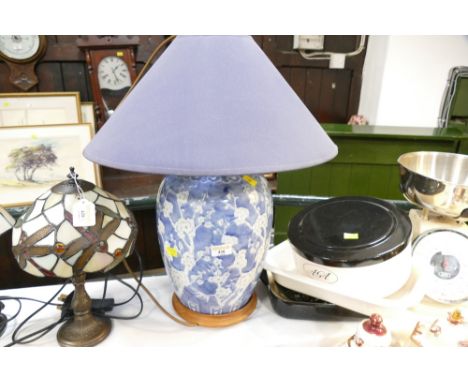 Bulbous blue and white lamp with blue shade  