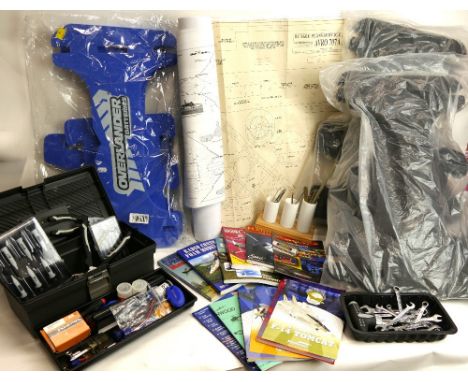 Basket of model kit / hobbyist tools, spanners, scalpels, precision tools, model plane plans and books, foam model plane disp
