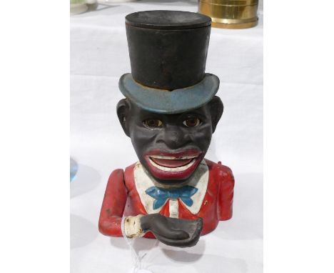 Cast iron money box in the form of a gentleman in top hat These items are listed on the basis they are illustrative of a bygo