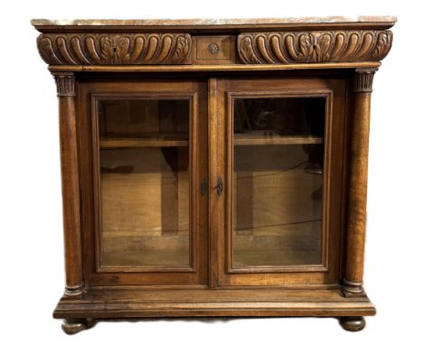 A 19th c.&nbsp; side cabinet with marble top over two gadrooned drawers, glazed doors before adjustable shelf flanked by colu