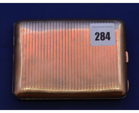A 9ct. yellow gold cigarette case, by Clark & Sewell, Chester 1918, engine turned decoration and engraved with monogram to ex