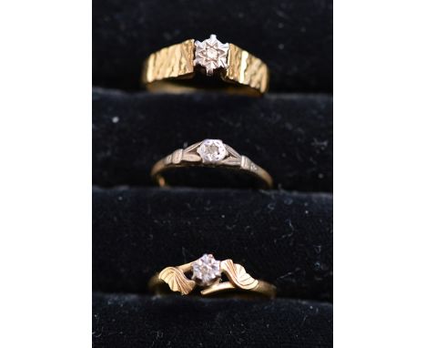 Three single stone diamond rings, on 18ct. yellow gold shanks, ring size K-N, 8.7grms. gross.