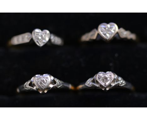 Four single-stone diamond rings, each in heart-shaped illusion setting on 18ct. yellow gold shank, ring sizes K-M, 9.7grms. g