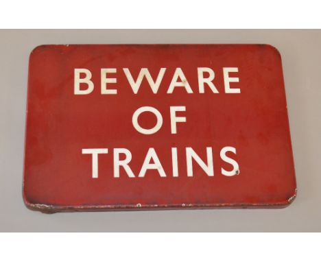British Railways midland region BEWARE OF TRAINS enamel sign. Good unrestored condition, chipped areas to edge of face side.