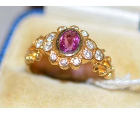 18ct ruby and diamond cluster ring, approximately 4.6g.