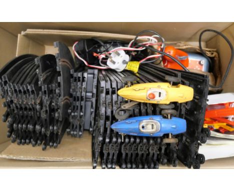 A Scalextric set with two cars and track, transformer, etc., together with another box of 1960s Scalextric including track, t