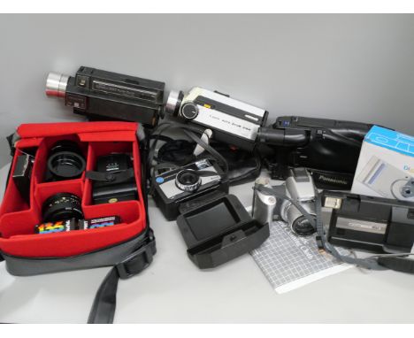 A collection of camera equipment including Olympus, Panasonic and camcorders