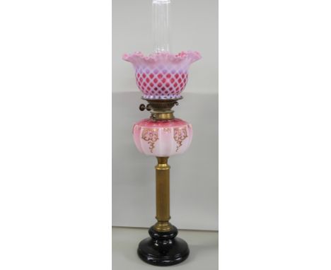 A tall pink glass and brass oil lamp, 70cm **PLEASE NOTE THIS LOT IS NOT ELIGIBLE FOR IN-HOUSE POSTING AND PACKING**