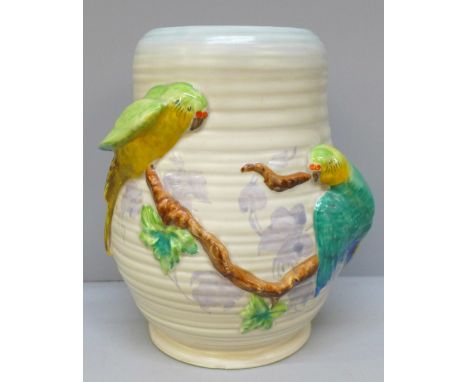 A Clarice Cliff Newport Pottery vase decorated with parrots, 21cm