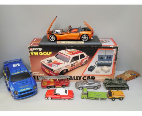 A box of model vehicles including Corgi VW Golf RC car, boxed