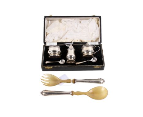 A silver boxed cruet set and a pair of salad servers with white metal handles. The cruet set comprising a shaker, two pots an