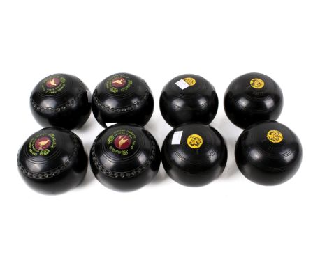 Two sets of four crown lawn bowls. Including Greenmaster size 01 and Henselite Classic Deluxe size 5 medium
